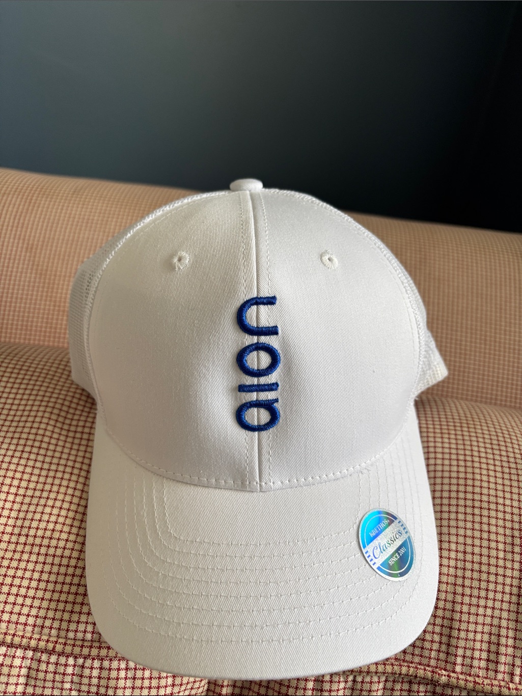 White Baseball Cap With Blue Embroidered Logo